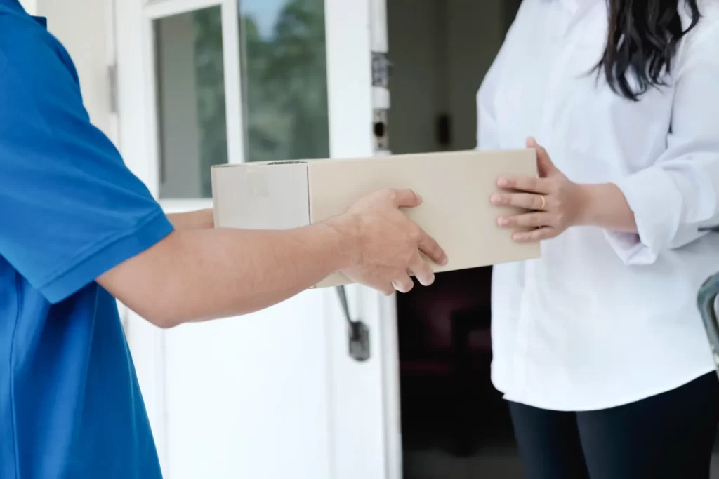 person receiving package at the front door utc ()